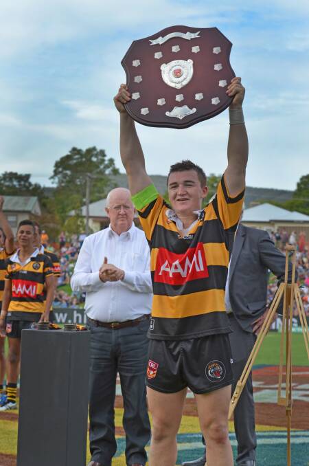 Greater Northern Tigers skipper and player of the final Max Altus lifts the shield after leading the U16s to Country Championship glory at Scully Park yesterday. Photo: Chris Bath 080516CBA01
