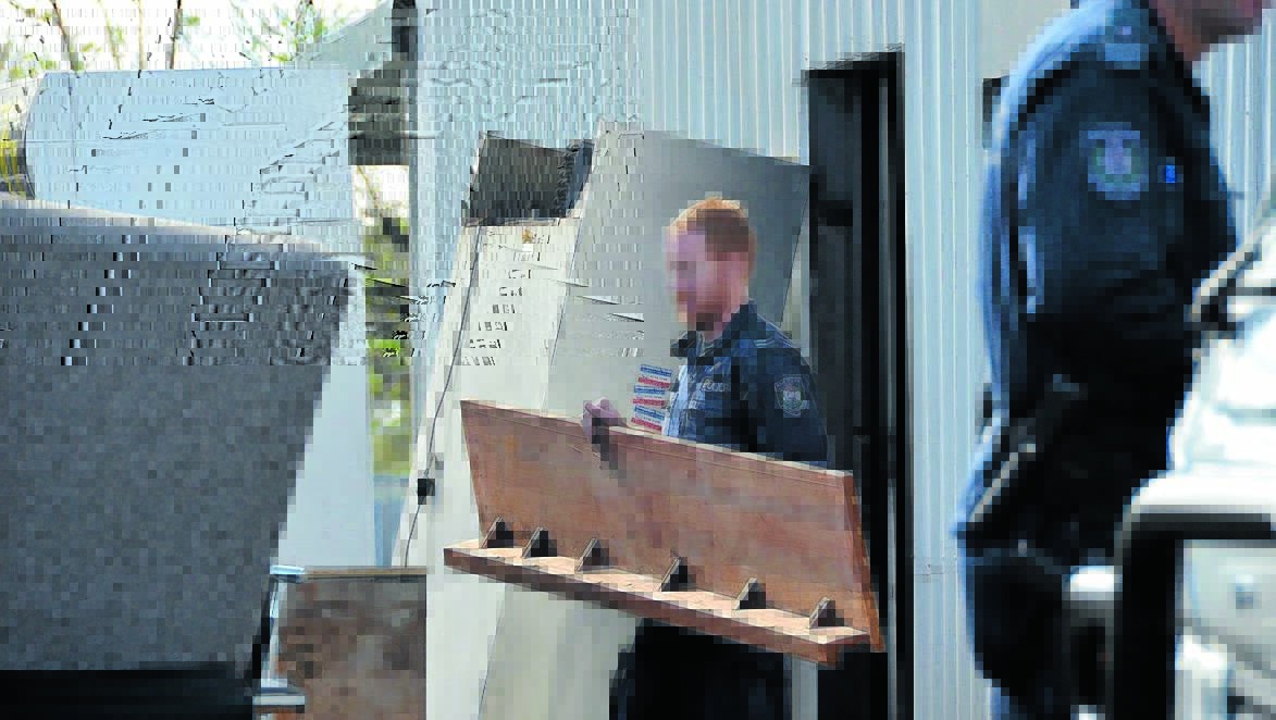 DISMANTLED: Oxley police and Strike Force Raptor officers stripped the Gladiators base bare last week. 
