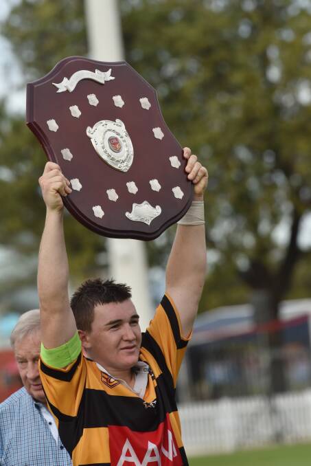 Greater Northern Under 16 skipper Max Altus holds the AAMI Shield aloft after his man of the match performance earned him and his teammates a thrilling Country title. He was later named in the Country Under 16s to tour Samoa. Photo: Geoff O’Neill 070516GOB13