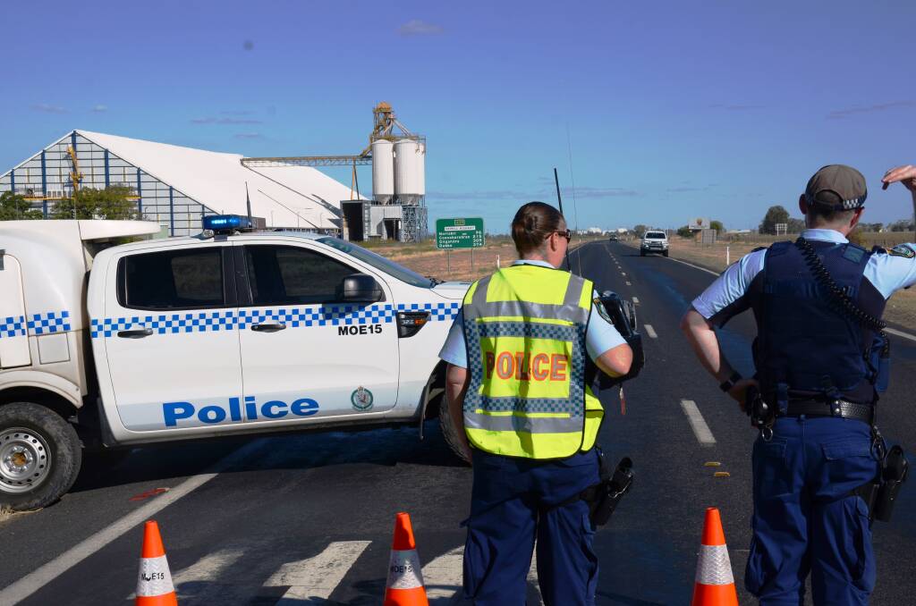 Police enforce a road block at Tycannah Creek on the Newell Highway. Photo: Matthew Purcell