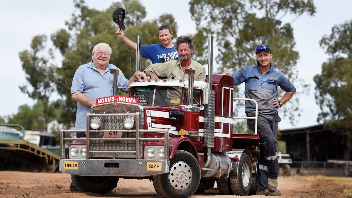 SHOW STOPPER: From left, Norm Mitchell with the mini Kenworth truck he built himself and donated to the club, and Patrick Challenger, 14, Randall 
Mannion and James Mannion. Photo: Gareth Gardner 290416GGC05