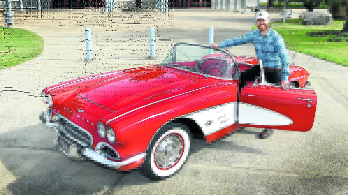 CLASSIC CARS: Ray Evans with Neville Evans’ 1961 Corvette ahead of this weekend’s motor show in Tamworth. Photo: Geoff O’Neill 100516GOA01