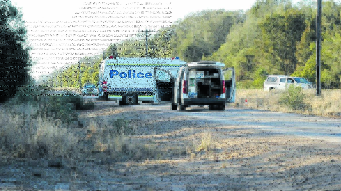 CRIME SCENE: Police and forensic crews at the location of the shooting at Croppa Creek, near Moree, in July 2014. Photo: Moree Champion