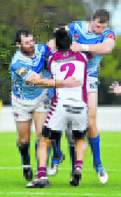 Narrabri captain coach and late penalty kicker Lachie Cameron and Jake Rumsby don’t leave much room for Wests winger Cameron McDonald as the Blues handed the Lions their maiden loss for the season on Sunday. Photo: Barry Smith 260616BSG02