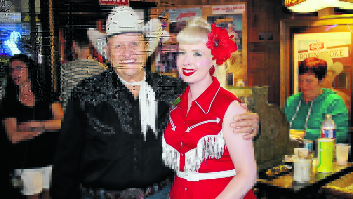 ​HISTORIC HONKY TONK: Shelley Minson with James R White, owner of the famed Broken Spoke in Austin, Texas.