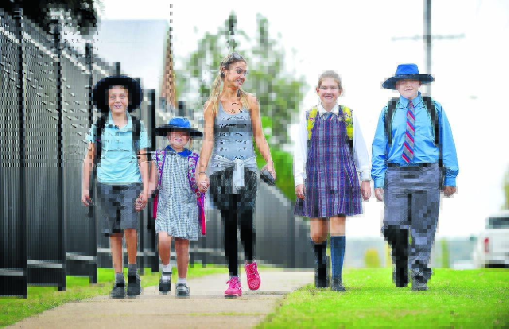 STEPPING OUT: Tamworth West Public School’s Rylan Wells, Eden Willcox, mum Jess Johnson, Harriet and George Smallwood walk safely to school. Photo: Barry Smith 180516BSD02