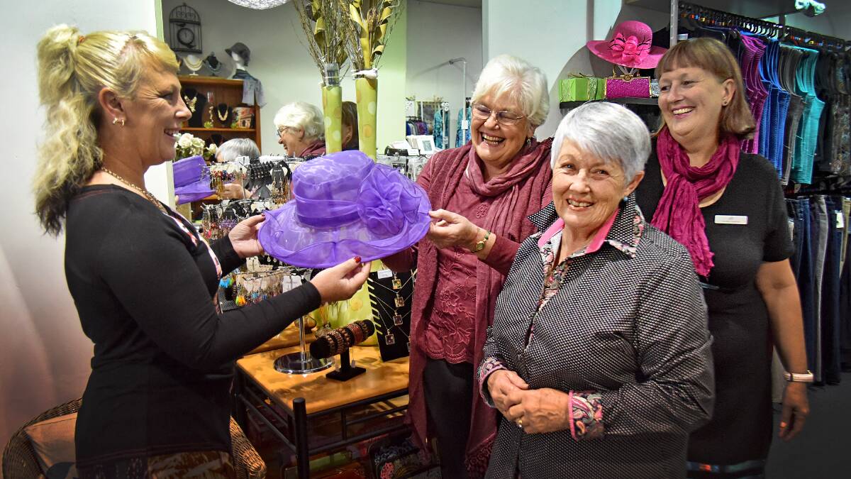 FASHIONS THAT CARE: Country Top Shop’s Lisa Murphy with Tamworth Hospital Auxiliary’s Robyn Pittman and Robyn Hely, and Country Top Shop owner Jo Verzendaal as they prepare for the winter fashion parade in aid of the hospital. Photo: Geoff O’Neill 060416GOA02