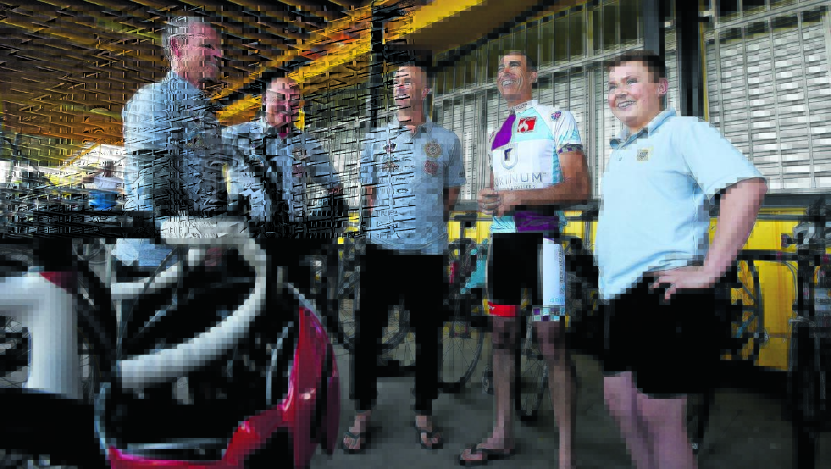 EDUCATION ON FIRE: Firefighting cyclists Lachlan Arnold, Greg Glass, Scott Henderson and Brett Butler with burns victim and future firefighter Joshua McCulloch from Tamworth High. Photo: Gareth Gardner 110516GGI02