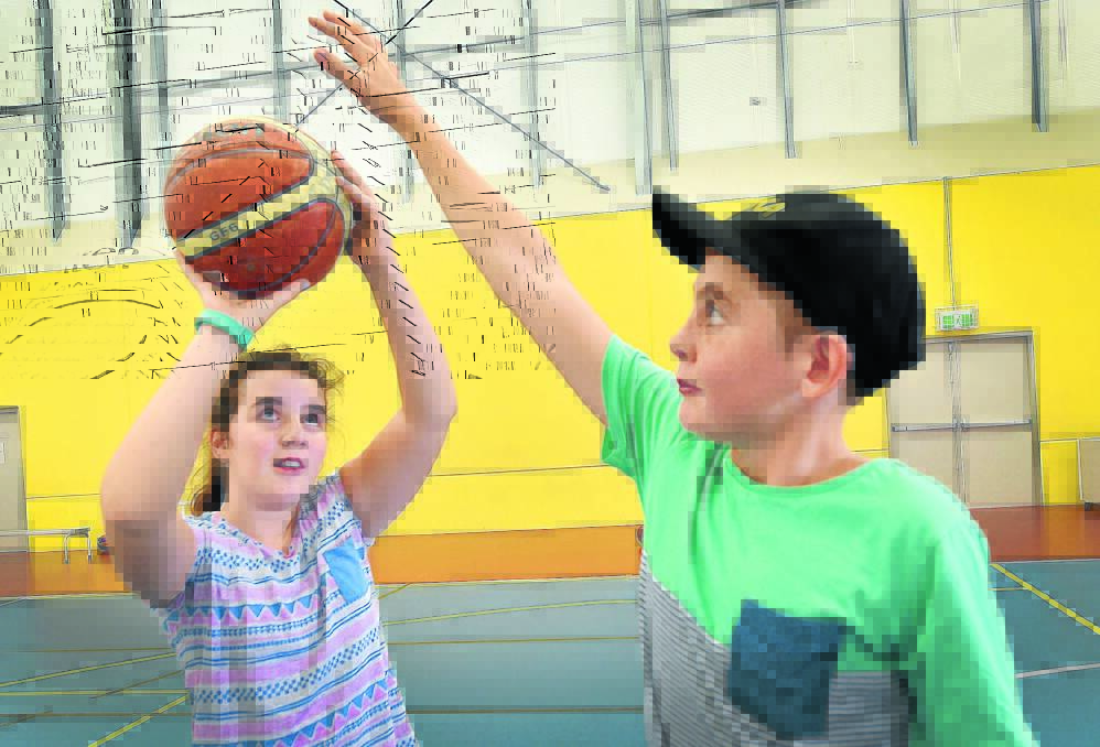 Emily Finucane and Jacob Bird make the most of their time on the basketball court. 190416GOE03