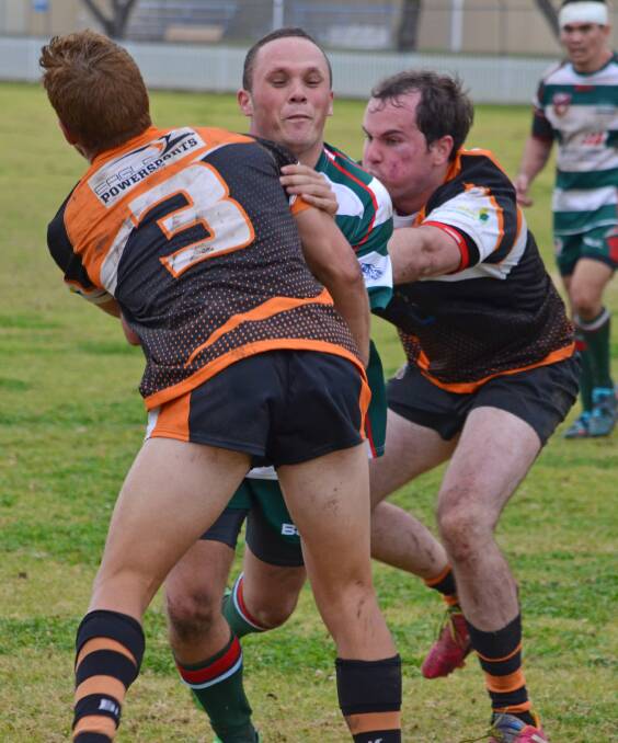 Manilla’s Mitch Doring (left) and Neil Bonnett meet Quirindi’s Darren Nean on the line as the Grasshoppers pulled off a big win over the tabletopping Tigers on Saturday at home.Photo: Chris Bath 180616CBA11