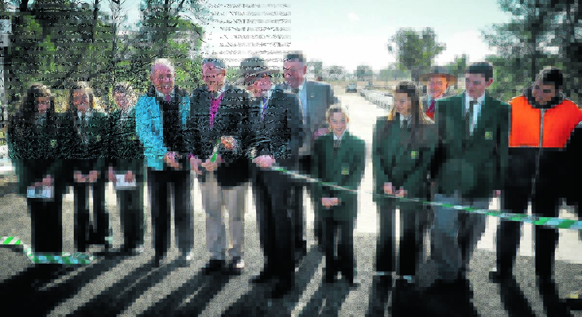 NEW ERA: There was quite a turnout at the opening of the new Abington Bridge. From left are, Bundarra Central School representatives Irene Hickman, Paige Vickery and Tahleah Gleeson, Senator John Williams, NSW Roads Minister 
Duncan Gay, Northern Tablelands MP Adam Marshall, Uralla shire mayor Michael Pearce, Cheyenne Hosking, Bianca Nelson, Bundarra Central School principal David Bieler, Luke Berry and Cowen Campbell.