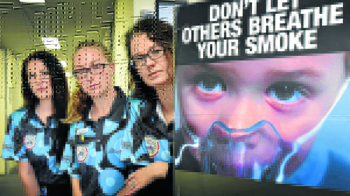 THINK OF OTHERS: Tamworth Aboriginal Medical Service's World No Tobacco Day advocates Erin Sutherland, Cancer Council NSW’s Dimity Betts and Heart Foundation’s Penny Milson highlighting the dangers of passive smoking. Photo: Geoff O'Neill 300516GOA01