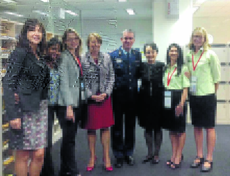 NEW SERVICE: Department of Justice’s Francine Clough, YWCA programs manager Neesha Eckersley, Women NSW’s Maria Twomey, YWCA chief executive Anna Bligh, Police Commissioner Andrew Scipione, minister Pru Goward, and Tamworth Family Support Services manager Tanya Rogers and general manager Belinda Kotris during the DVDS launch in Sydney.