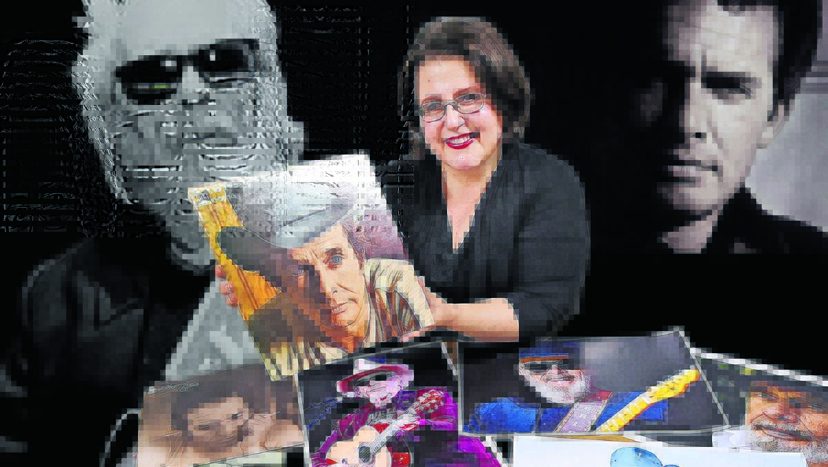 OKIE TRIBUTE: Tamworth singer-songwriter Carolyne Morris has organised a tribute show to Merle Haggard on Sunday, here with a small portion of Ross Murphy’s vinyl collection of Haggard. Photo: Gareth Gardner 260416GGD02