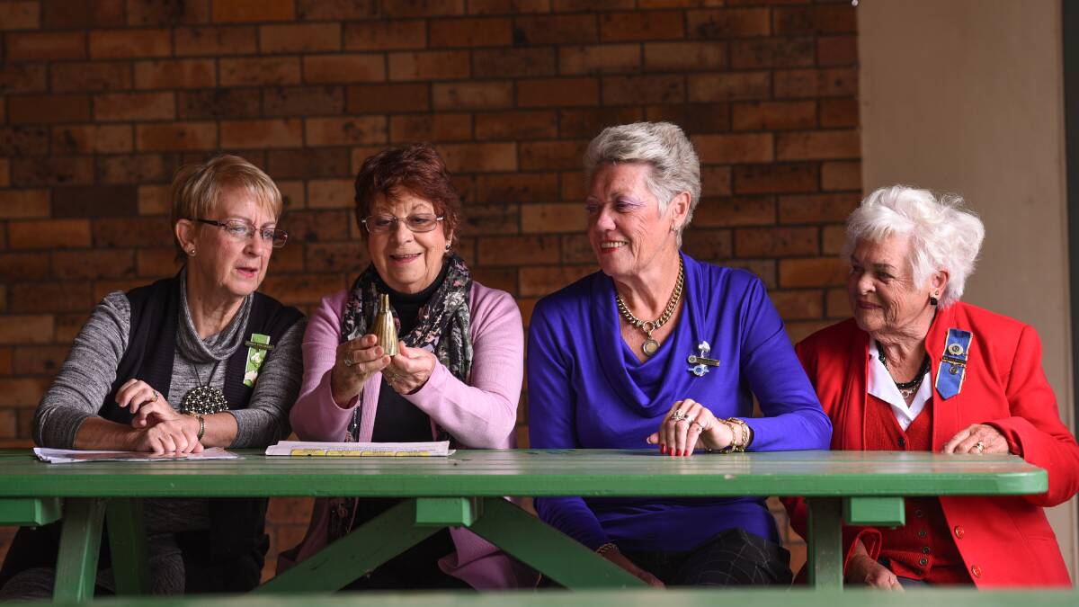 A REAL HUMDINGER: Associated Country Women of the World president Ruth Shanks, left, with CWA Wanthella group secretary Claire Lennon holding the tiny bell, group president Margaret Schofield and group vice-president Doreen Goddard. Photo: Gareth Gardner 040616GGC01