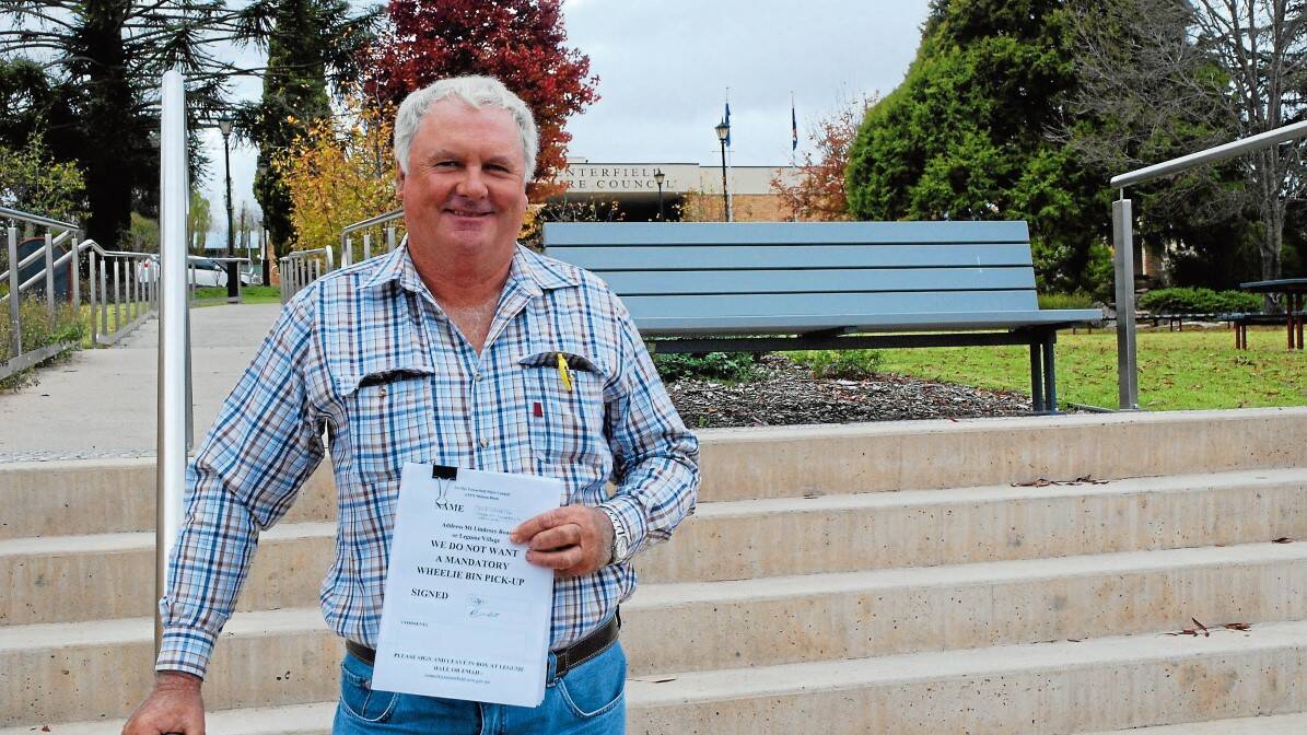 WHY THE RUSH? Legume farmer Glen Lamb travelled to town to hand over his neighbours’ petitions against the mandatory rubbish collection.