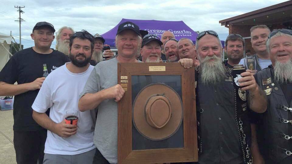 The winners of ‘the pub hat’ auction, The Medowie Boys and The Veterans Corps Inc, spent $1400.
