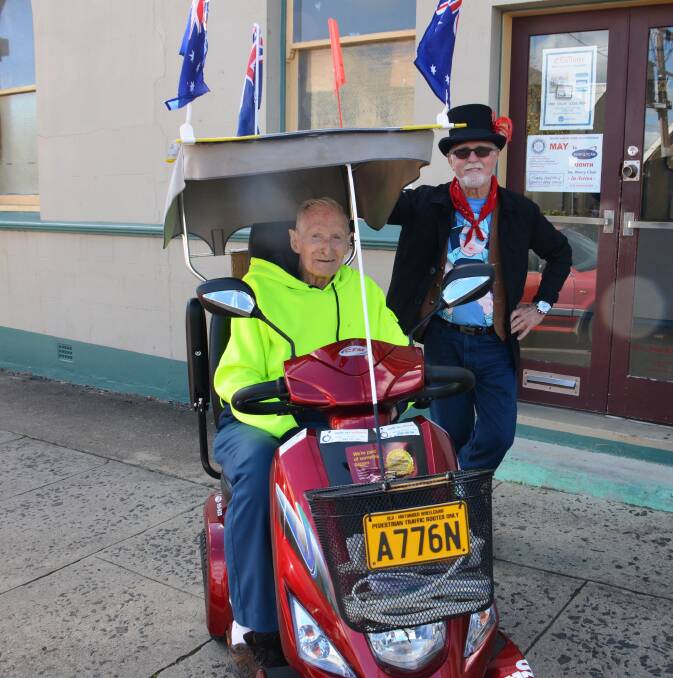 NINETY year old Keith Hendry and helper Brian Boyd outside the Examiner office last week