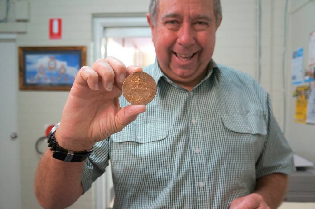 Inverell sub-branch secretary Graeme Clinch holds the Alexandre Patte’s    medallion which will soon be returned home to Amiens, France. 