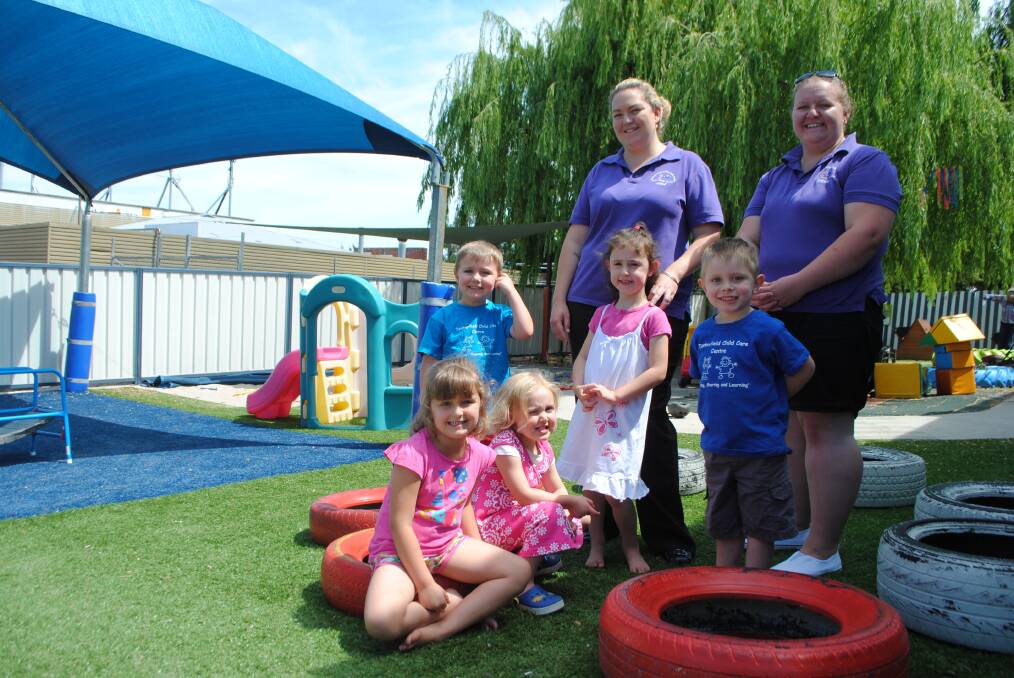 FUNDING FOR TRAINING: Tenterfield Child Care Centre director Nicole Foster and educator Benda Willis with children Claire Vasta, Jessica Johnston, Tyler Campbell, Indianna Crotty and Joshua Tasker.