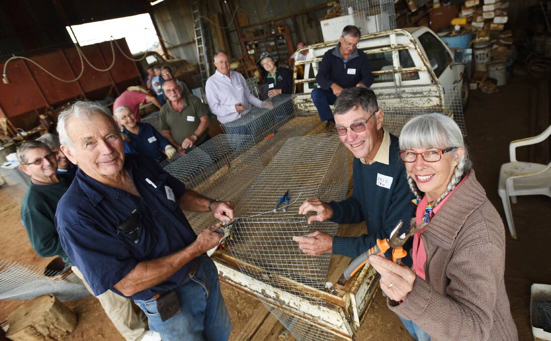 HOW TO:  Eric Fair, right, gives workshop participants John Nalder from Hallsville and Belinda Taylor from Tamworth, the good oil on building a feral bird trap.  Photo: Gareth Gardner 030516GGB02