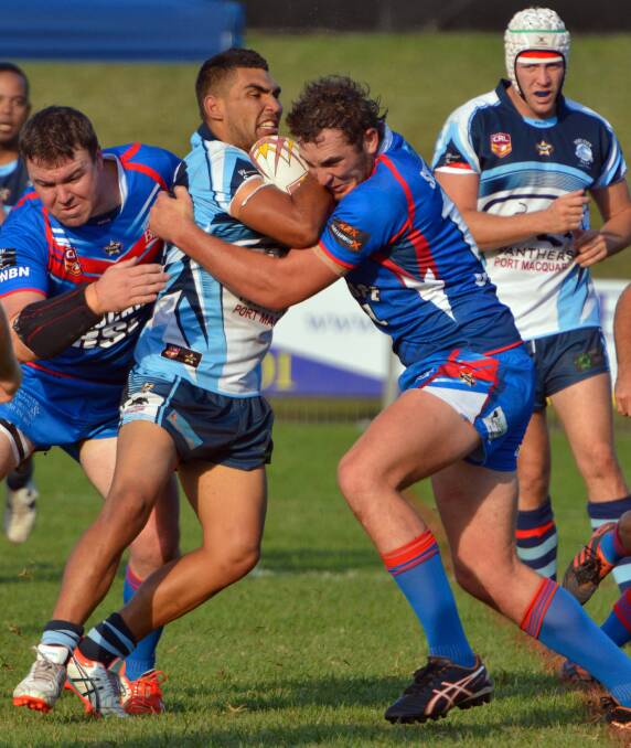 Collision:  The Port City Breakers were out muscled by the Wauchope Blues in what was pegged as a massive Anzac Day showdown.
Richie Roberts runs into Beau Kettle and some heavy Blues defence.                             
Pic: MATT ATTARD