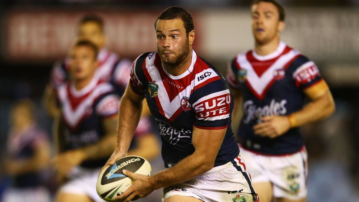 Boyd Cordner of the Roosters runs the ball during the round seven NRL match between the Cronulla-Sutherland Sharks and the Sydney Roosters at Remondis Stadium on April 19, 2014 in Sydney, Australia. Photo: Mark Nolan/Getty Images.
