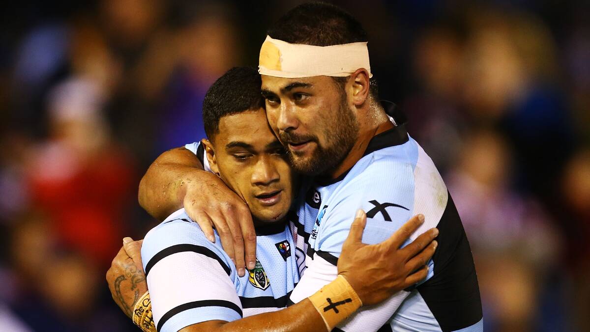 Ricky Leutele of the Sharks is congratulated by team mate Andrew Fifita after scoring during the round seven NRL match between the Cronulla-Sutherland Sharks and the Sydney Roosters at Remondis Stadium on April 19, 2014 in Sydney, Australia. Photo: Mark Nolan/Getty Images.