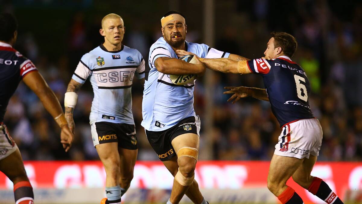 Andrew Fifita of the Sharks runs the ball during the round seven NRL match between the Cronulla-Sutherland Sharks and the Sydney Roosters at Remondis Stadium on April 19, 2014 in Sydney, Australia. Photo: Mark Nolan/Getty Images.
