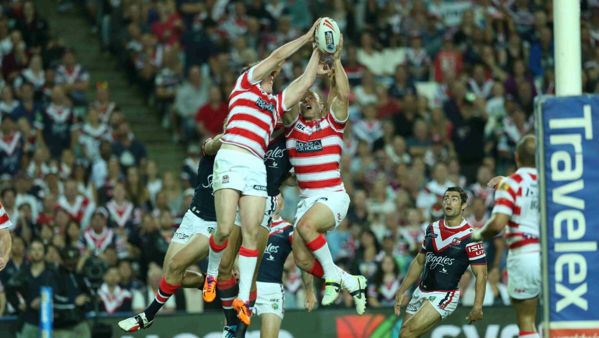 Roosters and Wigan players fly for a high ball in the World Club Challenge game at Allianz Stadium. Picture: Anthony Johnson