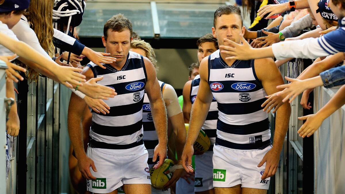 Joel Selwood of the Cats leads his team out onto the field at the MCG. Geelong ran out 87 points to Collingwood's 76. Picture: Getty Images