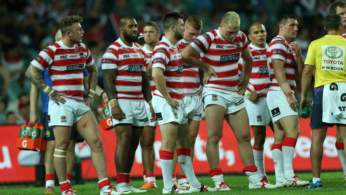 Wigan players wait for the Roosters to convert a try in the World Club Challenge game against Wigan Warriors at Allianz Stadium. Picture: Anthony Johnson