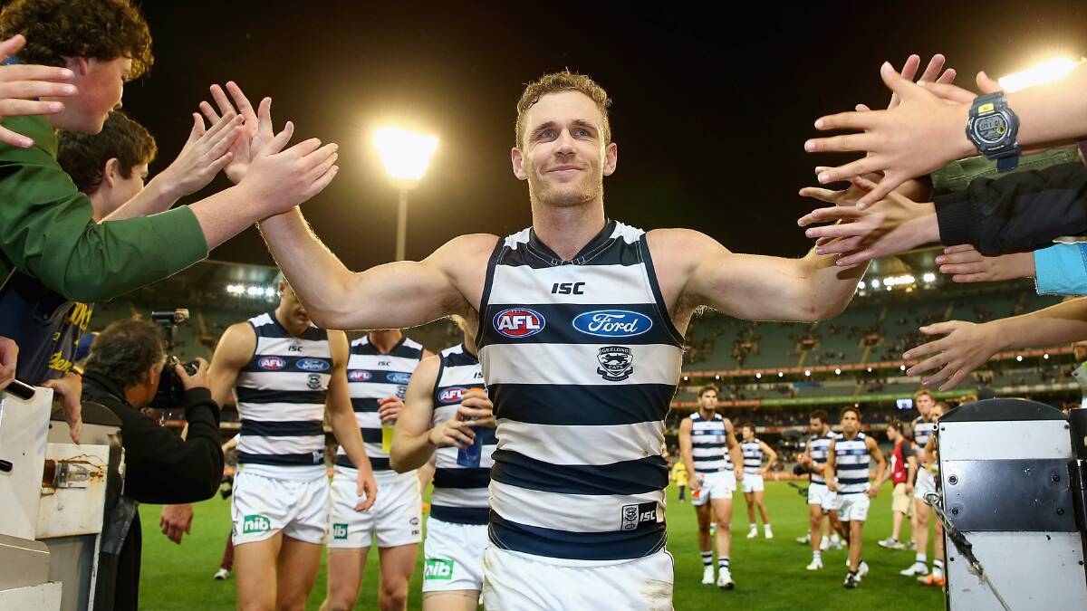 Joel Selwood of the Cats high fives fans after winning the round three AFL match at the MCG. Geelong ran out 87 points to Collingwood's 76. Picture: Getty Images