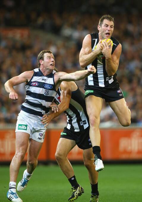Travis Cloke of the Magpies marks infront of Steve Johnson of the Cats at the MCG. Geelong ran out 87 points to Collingwood's 76. Picture: Getty Images