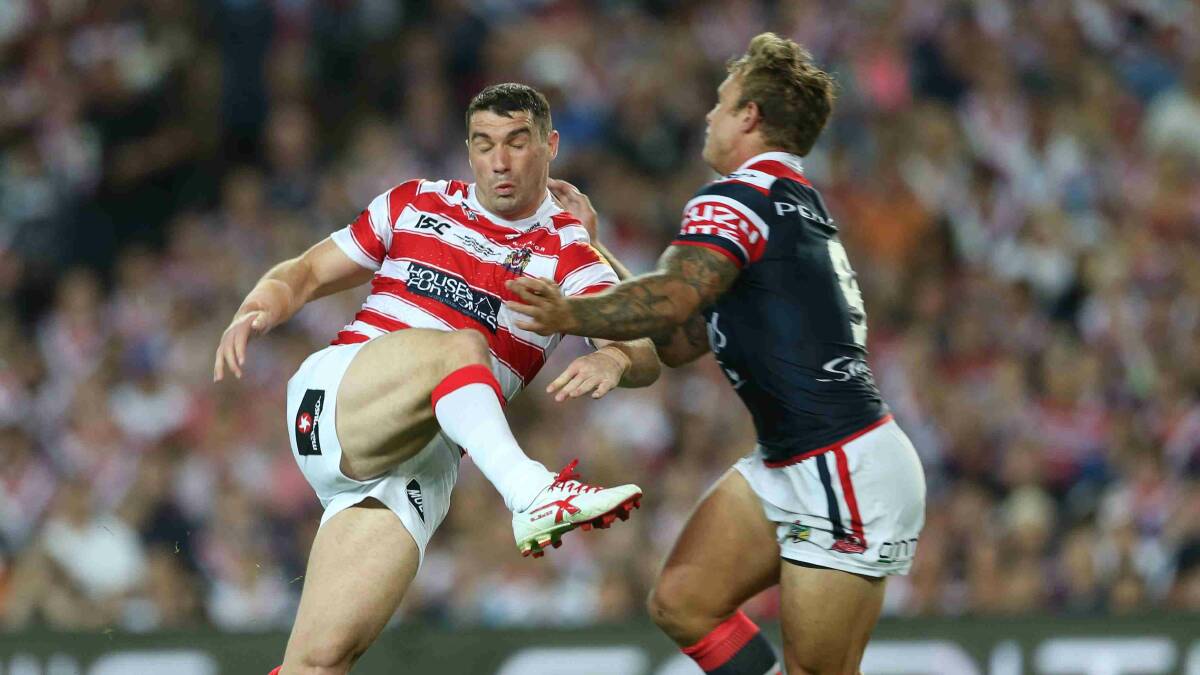 Wigan gets a kick away in the World Club Challenge game against Sydney Rooster at Allianz Stadium. Picture: Anthony Johnson