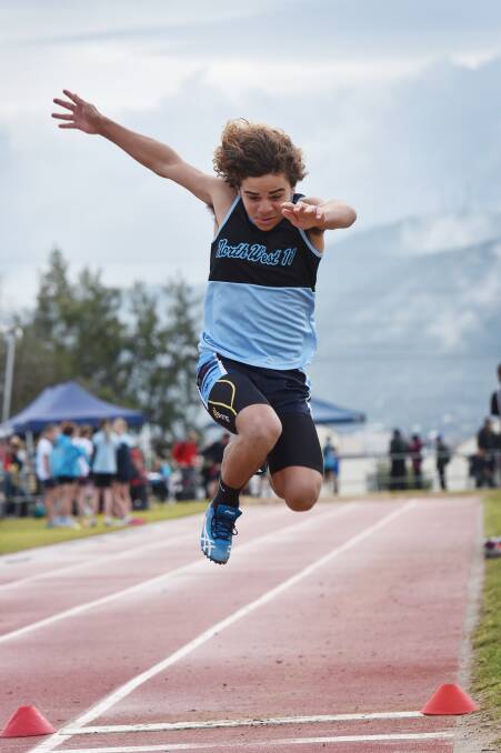 Coonamble’s Kevin Thurston-Welsh looks long  in the 14 boys’ long  jump.  Photo: Geoff O'Neill. 240715GOB07
