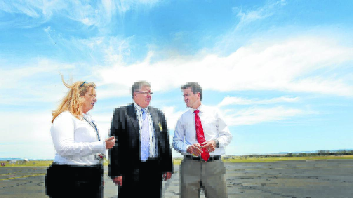 FLYING HIGH: Tamworth Airport manager Julie Stewart, Tamworth mayor Col Murray and member for Tamworth Kevin Anderson on the apron, which will be upgraded. Photo: Gareth Gardner 081215GGA010