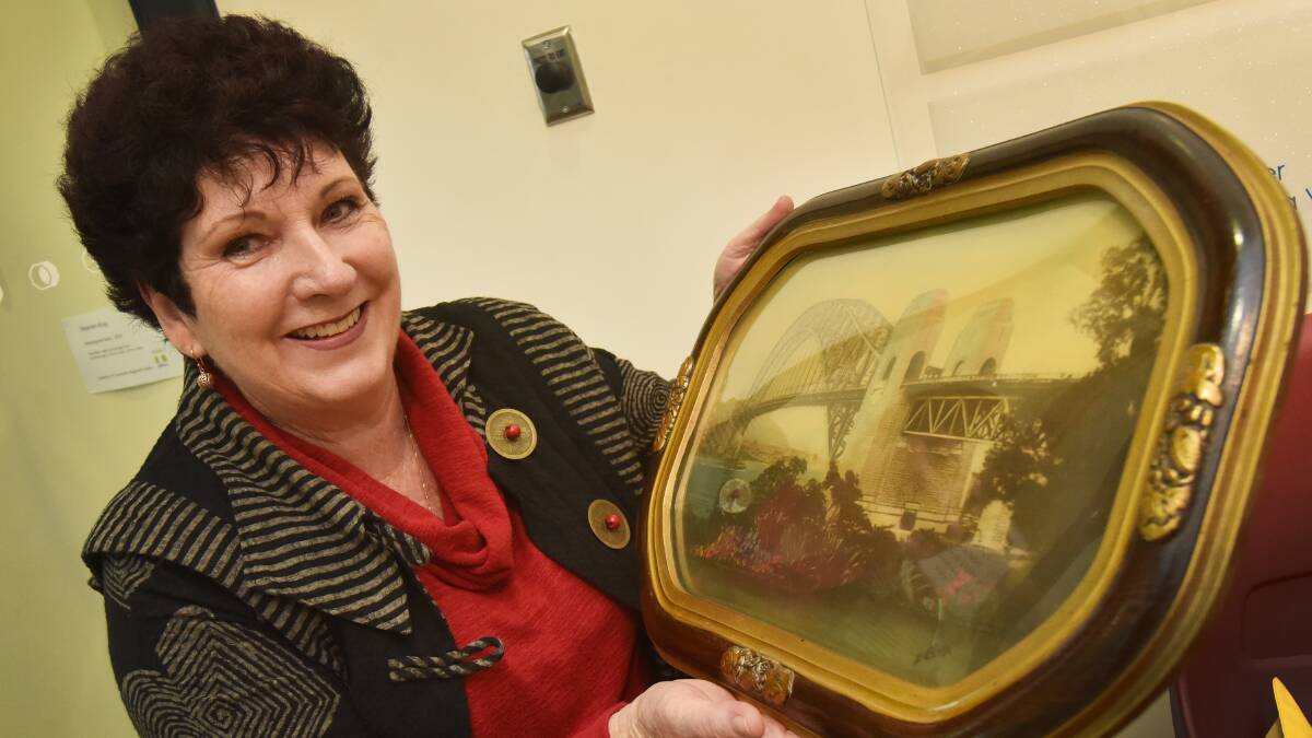 WAITING FOR VALUATION: Lorraine Key with her artwork to be valued. Photo: Geoff O’Neill 190615GOC02