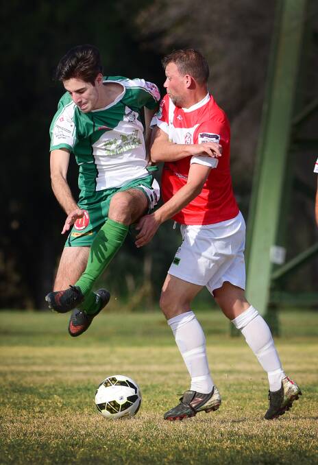 East Armidale’s Lewie Russoniello gets airborne in this contest with OVA’s Adam Watson during last weekend’s quarter-final. Tomorrow Easts host Gunnedah for a spot in the preliminary final. Photo: Gareth Gardner 220815GGC09