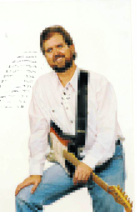SIGNATURE TUNE: Dave Craswell as we would remember him best, smiling and with a wonderful talent in music.