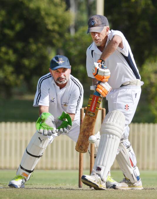 Warren McWilliams scored runs for Mid North Coast on their sweep through Northern Inland that yielded two wins and a loss to Tamworth. Here McWilliams plays defensively as Tamworth wicketkeeper and topscorer Barry Everingham concentrates on his gloveman’s task.  Photo: Barry Smith  271115BSF21