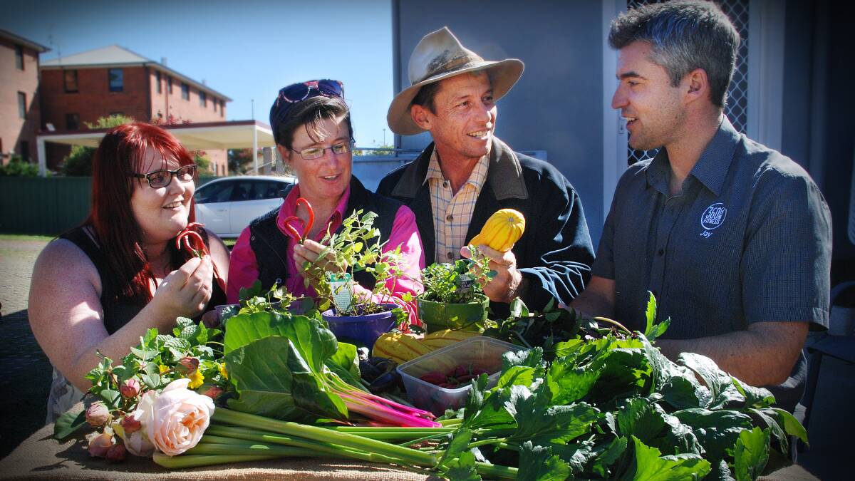 FRESH FOOD PEOPLE: Anna Treneman, Hether MiLane, Jonathan Harris and Jay Lynch inspect some of the locally grown fruit and vegetables that will soon be sold at a new growers market in Tamworth. Photo: Ross Tyson 280415JOA03