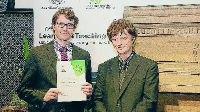 REWARDED: Fredy-Roberto Valenzuela, left, at the awards ceremony with John Croucher, the Prime Minister's University Teacher of the Year for 2013.