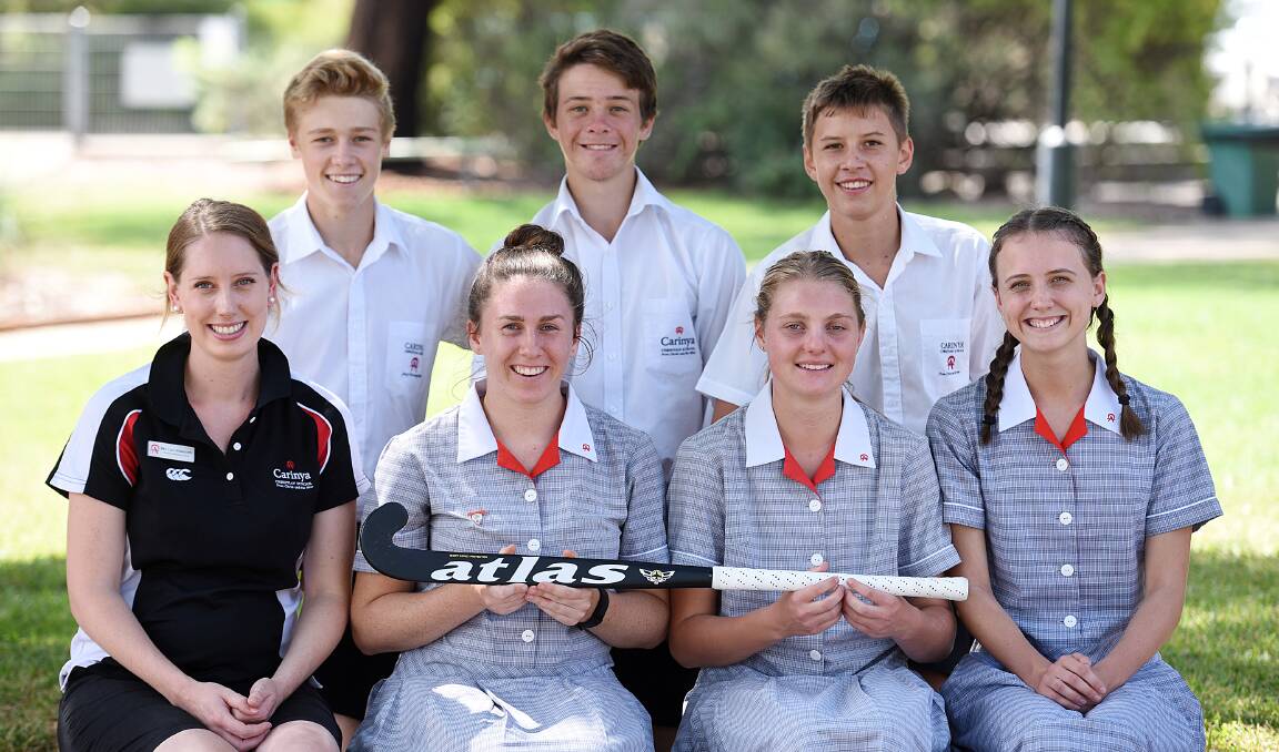 Carinya hockey 'rookies'  (back from left) Angus Richards, Lachlan Batley and Ryan King with winning veterans (front from left) Lara Bickersteth (assistant coach), Maddie Powell, Abigail Doolan and Annie Fotheringham after taking out their fourth straight CSSA title. Absent: Dolly Powell. Photo: Gareth Gardner  030216GGCD01