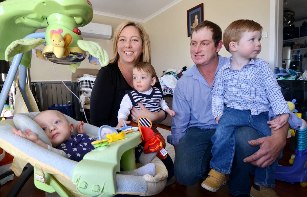 WYATT’S WORLD: The Powell family, Wyatt, mum Christie, Wyatt’s twin Jack, dad Andrew and Riley, 2, at their Bendemeer home.  Photo: Barry Smith 140815BSD03