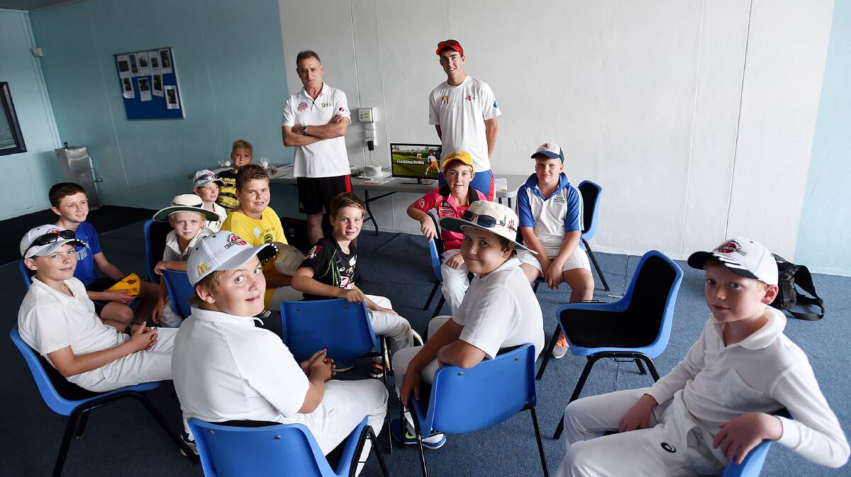 Former Australian fast bowler Len Pascoe (left) and coach Tom Fitzgerald with some of the youngsters at yesterday’s Shaun Brown Coaching Clinic in Tamworth. 
Photo: Gareth Gardner 260116GGA01