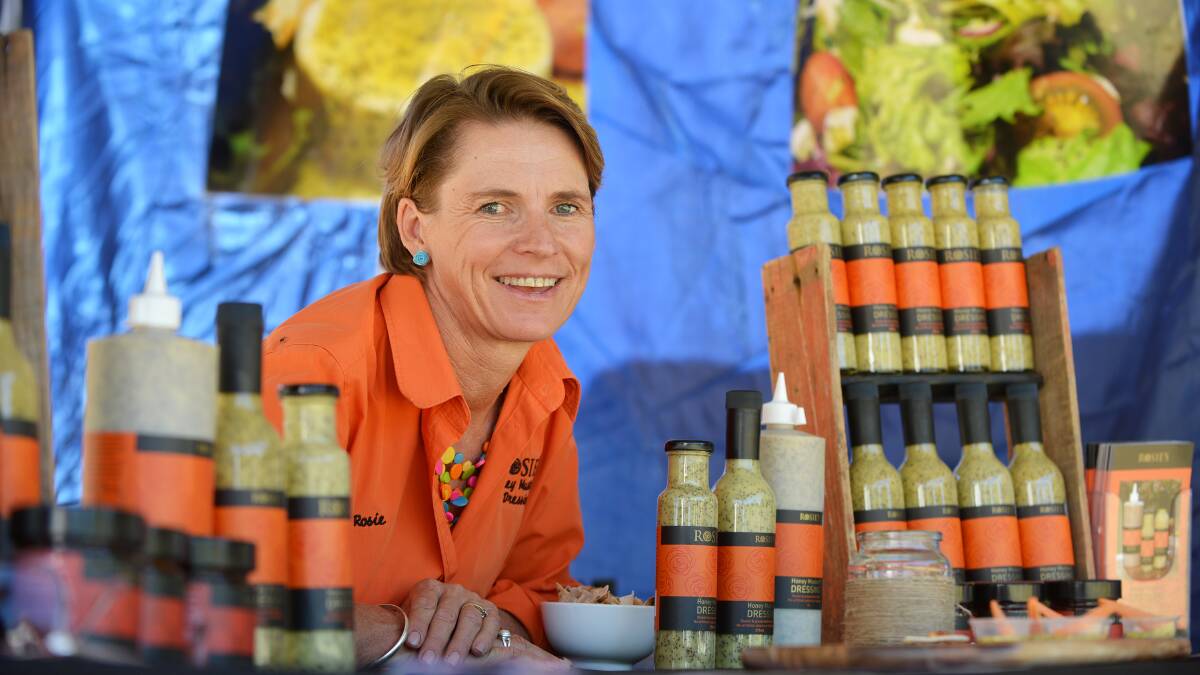 TASTY MORSELS: Rosie Turnbull from Quambone, near Warren, with her Rosie’s Honey Mustard Dressings at Taste in the Park. Photo: Barry Smith 030416BSD21