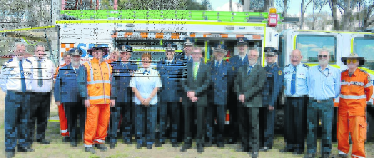 ALWAYS PREPARED: SES volunteers and members including Inverell SES unit controller Dale Hersee, next to Northern Tablelands MP Adam Marshall (centre), acting SES North West region controller Andrew Galvin, Inverell Shire Mayor Paul Harmon and SES director region west Scott Hanckel with the new medium storm-response vehicle.