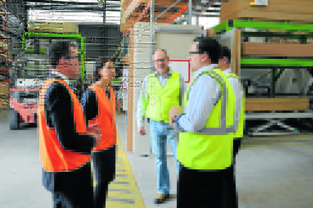 SITE VISIT: Northern Tablelands MP Adam Marshall and NSW treasurer Gladys Berejiklian meet with staff and management at Armidale's Uniplan Group, manufacturers of transportable homes and cabins, which employs more than 100 people. They are pictured with Marius van der Walt, Jerry Scott and Don Scott.