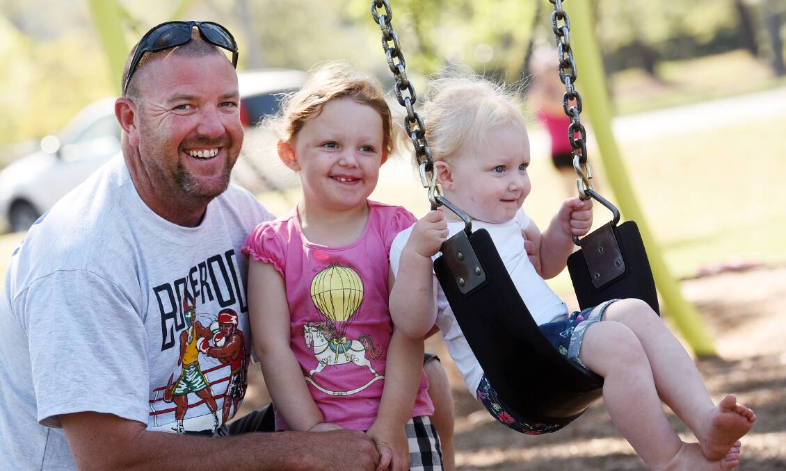 FAMILY TIME: Tamworth dad Steve Chaffey made the most of yesterday’s public holiday, heading to a local playground with children Alex, 3, and Eloise, 2.
 Photo: Gareth Gardner 051015GGA02